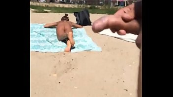 Play Masturbating dick on a nude beach